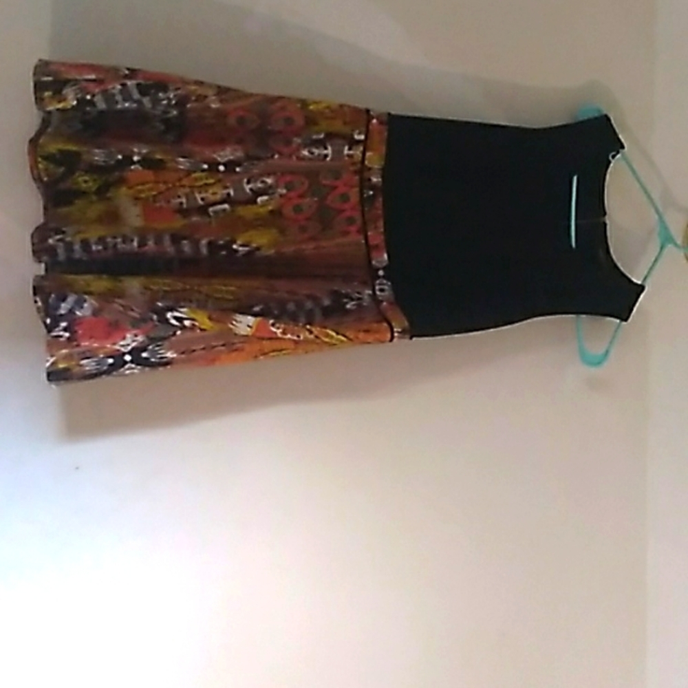 Fashion to figure Black top with gold,orange, black bottom color  dress.